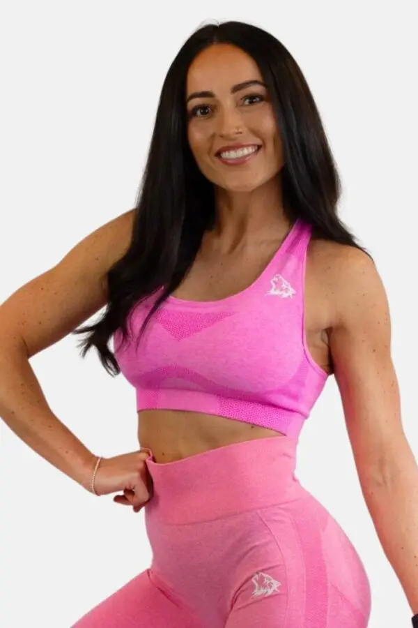 A woman in pink sports bra and leggings.