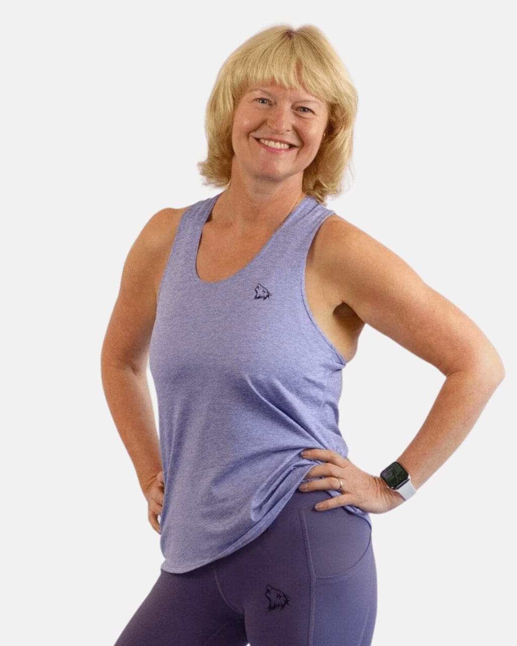 A woman in purple tank top and blue shorts.
