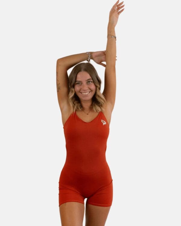 A woman in red is doing yoga