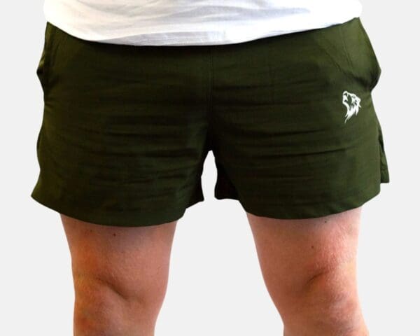 A person wearing green shorts and white shirt.