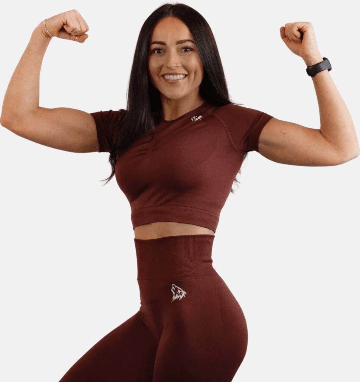 A woman in maroon outfit flexing her muscles.