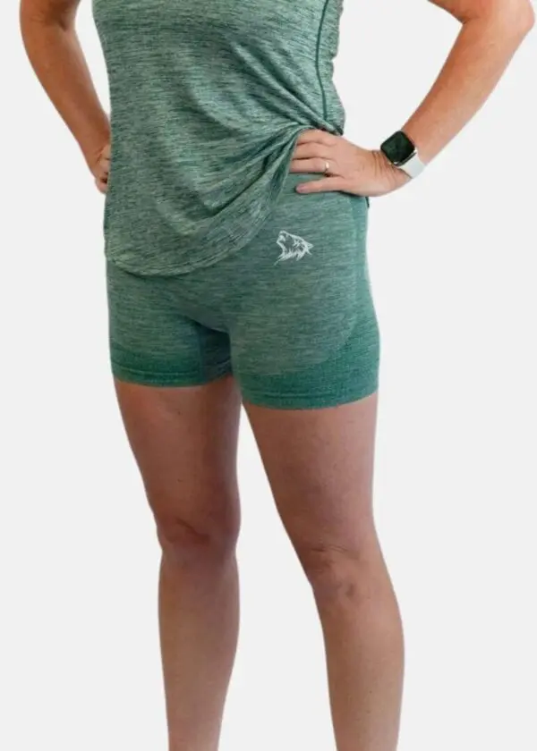 A person wearing green shorts and a t-shirt.