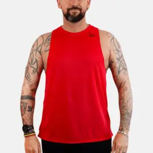 A man with tattoos wearing red tank top.