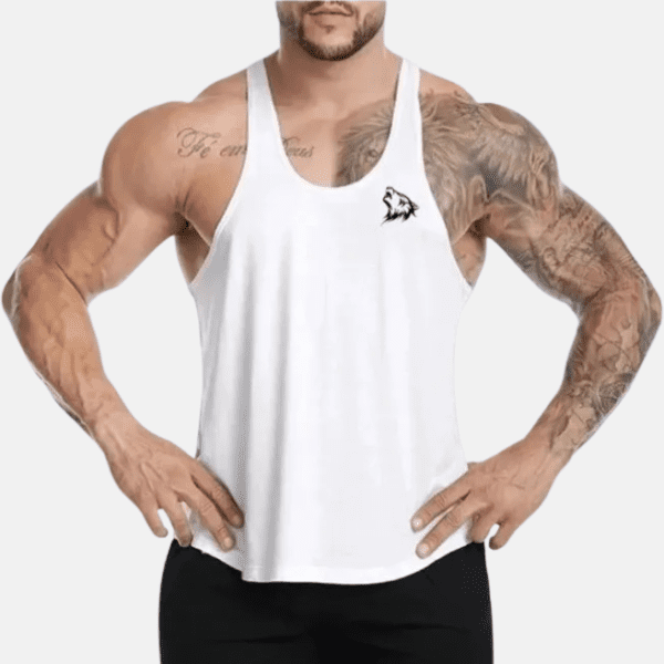 Man wearing a white tank top with wolf logo.