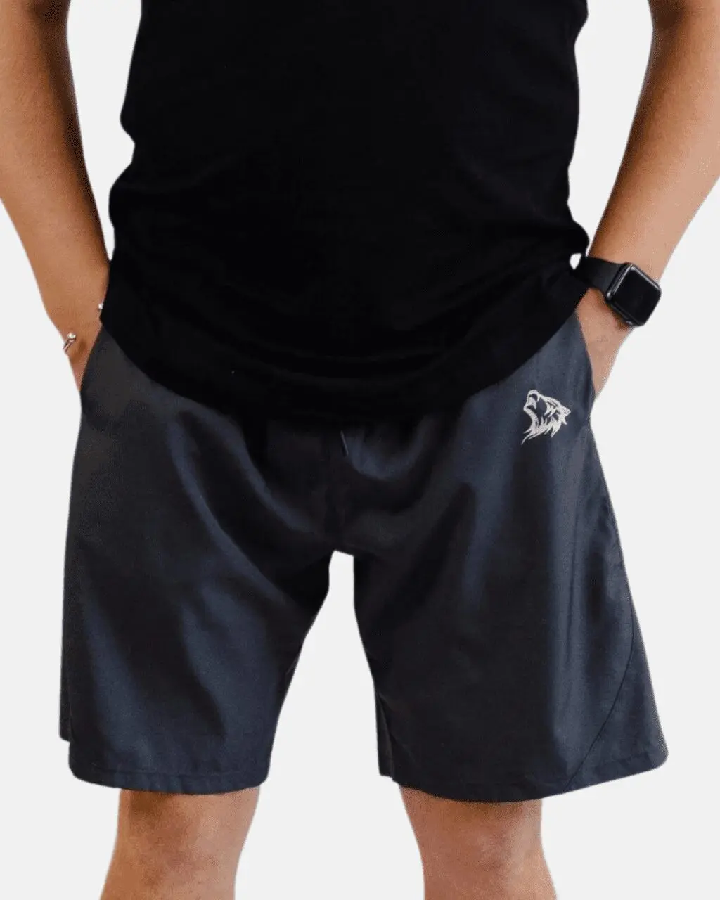 A man wearing black shorts and a black shirt.