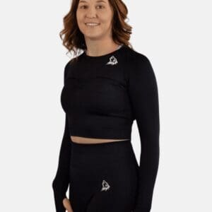 A woman in black long sleeve shirt and shorts.