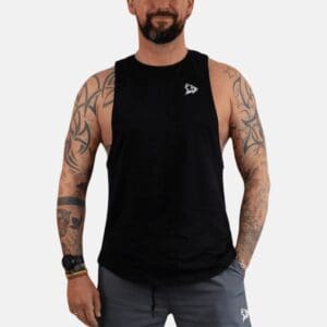 A man with tattoos and glasses wearing a black tank top.