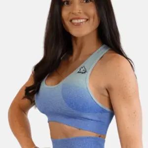 A woman in blue sports bra and leggings.