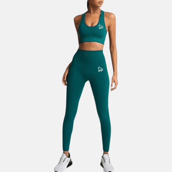 Woman wearing green workout leggings and bra.