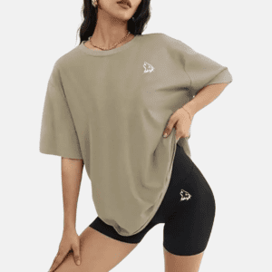 Woman in oversized shirt and bike shorts.